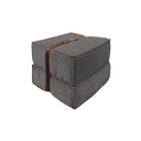 Pouf design Docker in velluto grigio con dettagli in pelle