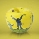 Salvadanaio a forma di mela gialla in stile Keith Haring, accessorio casa di design artistico