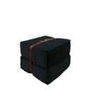 Pouf design Docker in velluto nero con dettagli in pelle